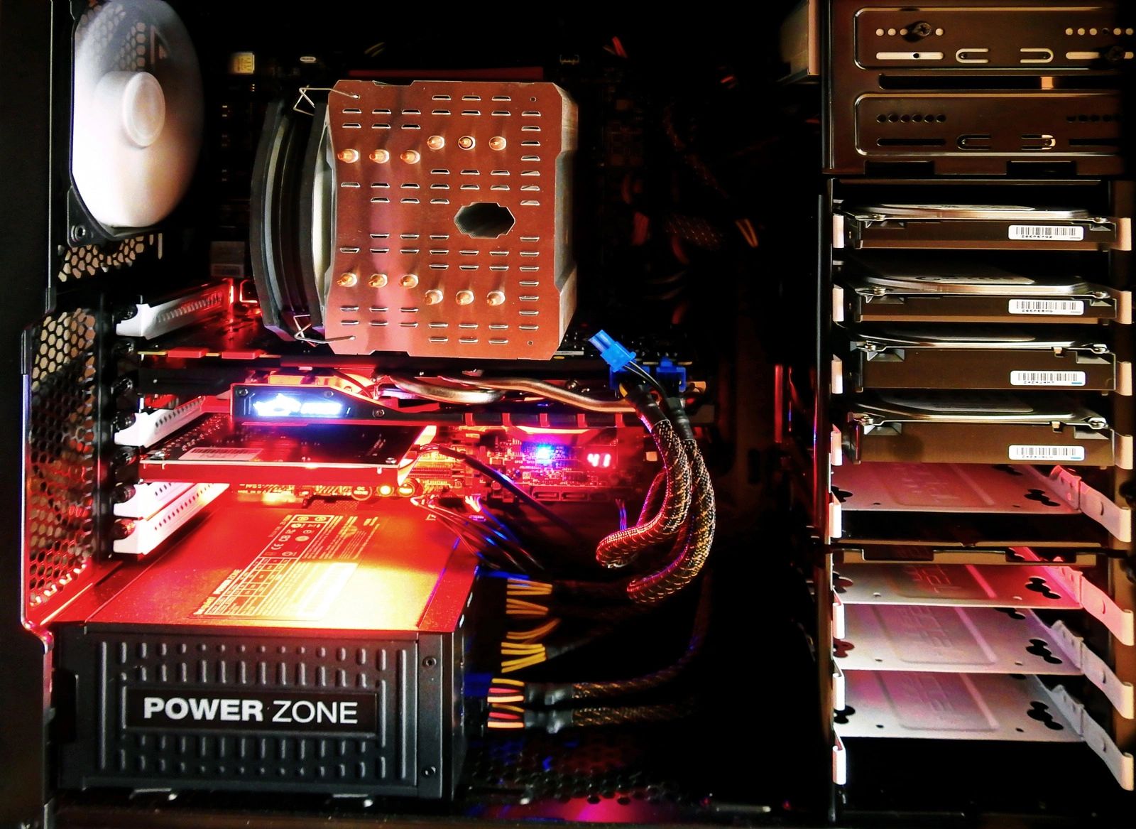 Open desktop computer with visible internal components and diagnostic lighting