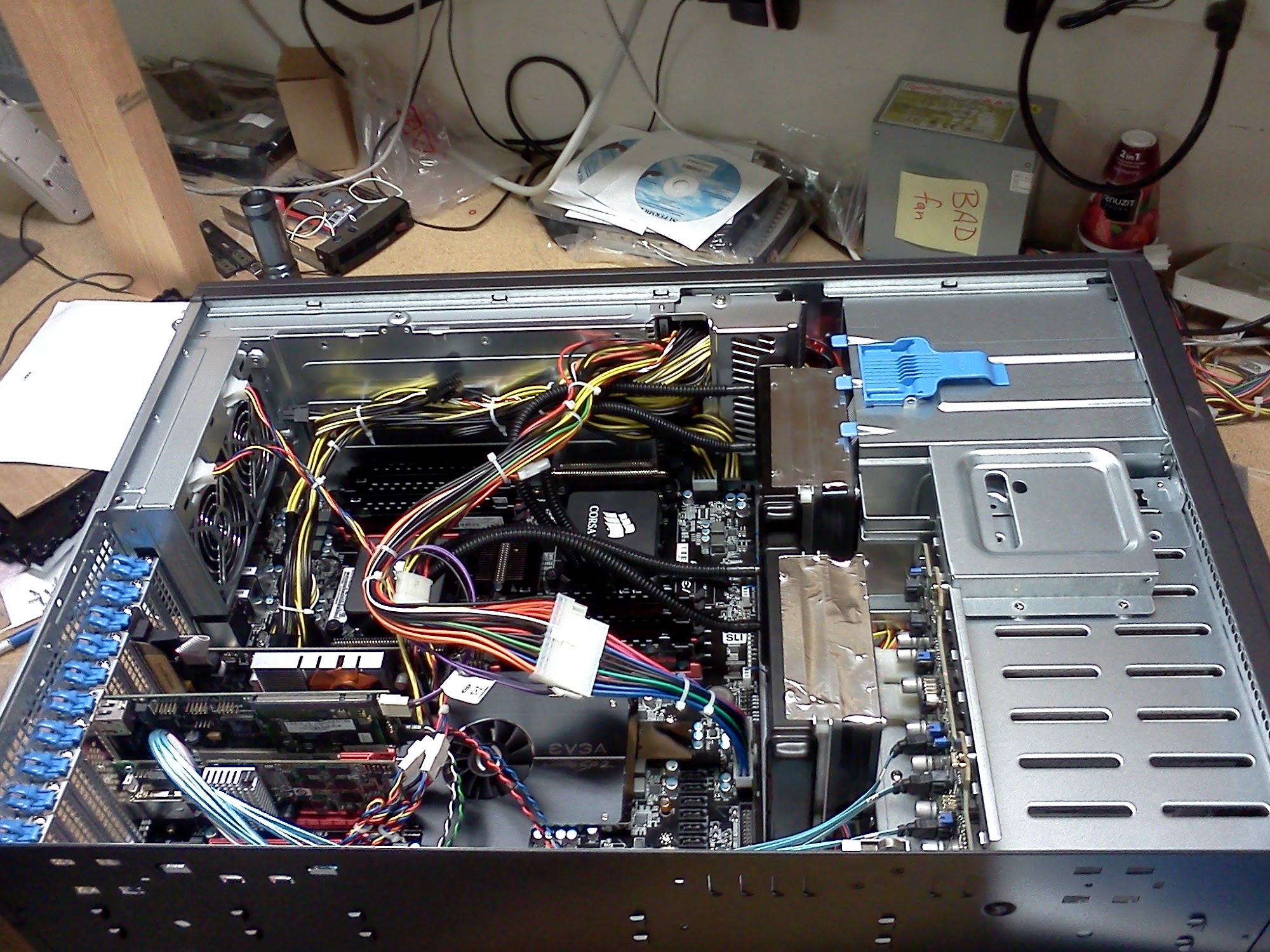 Open computer chassis with cables and internal components